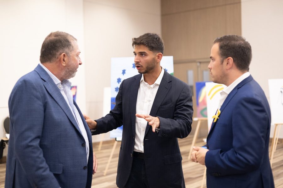 Ben talking with guests at the exhibition